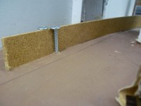 Hardboard curved to make a guide